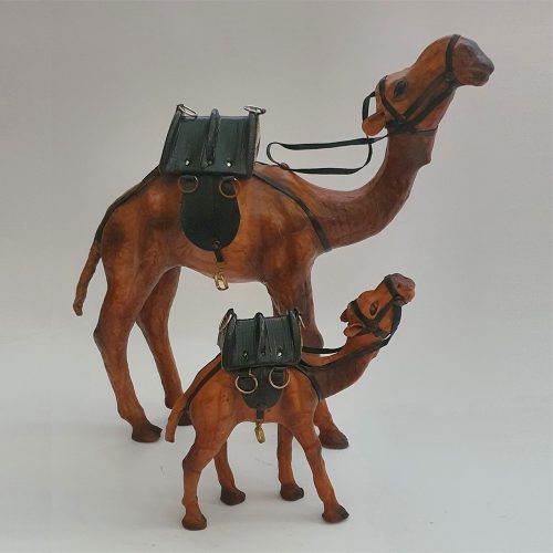 Two leather camel toys standing next to each other